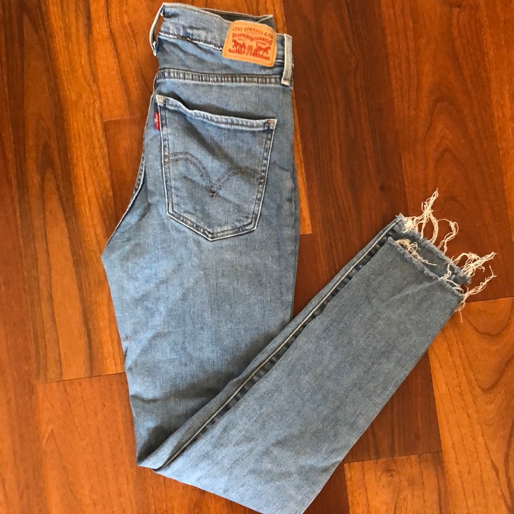 High-waisted Levi’s skinny jeans w/ frayed hems